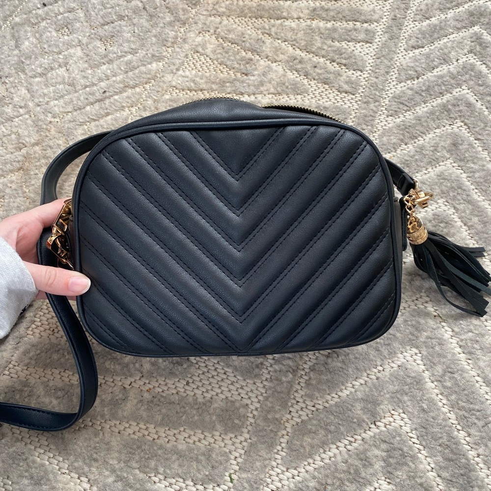 Black crossbody with tassel. Barely used, like new!